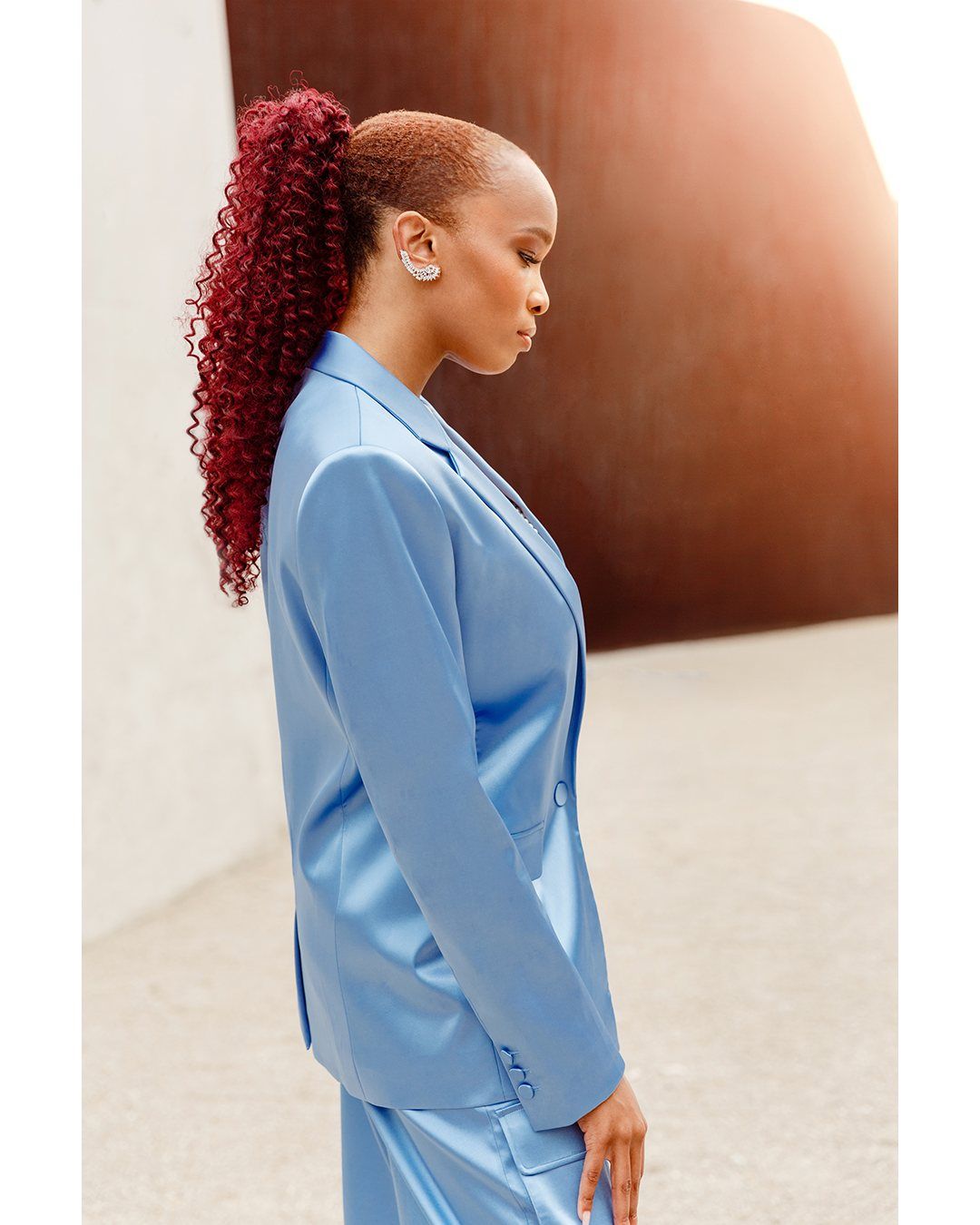 Florie in profile with her red curls
