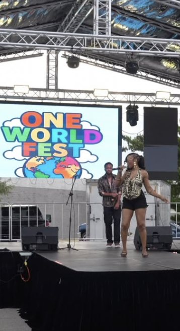 Florie performing on the One World Fest stage
